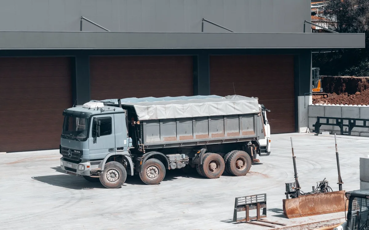 Heavy-duty dump truck at an industrial construction yard